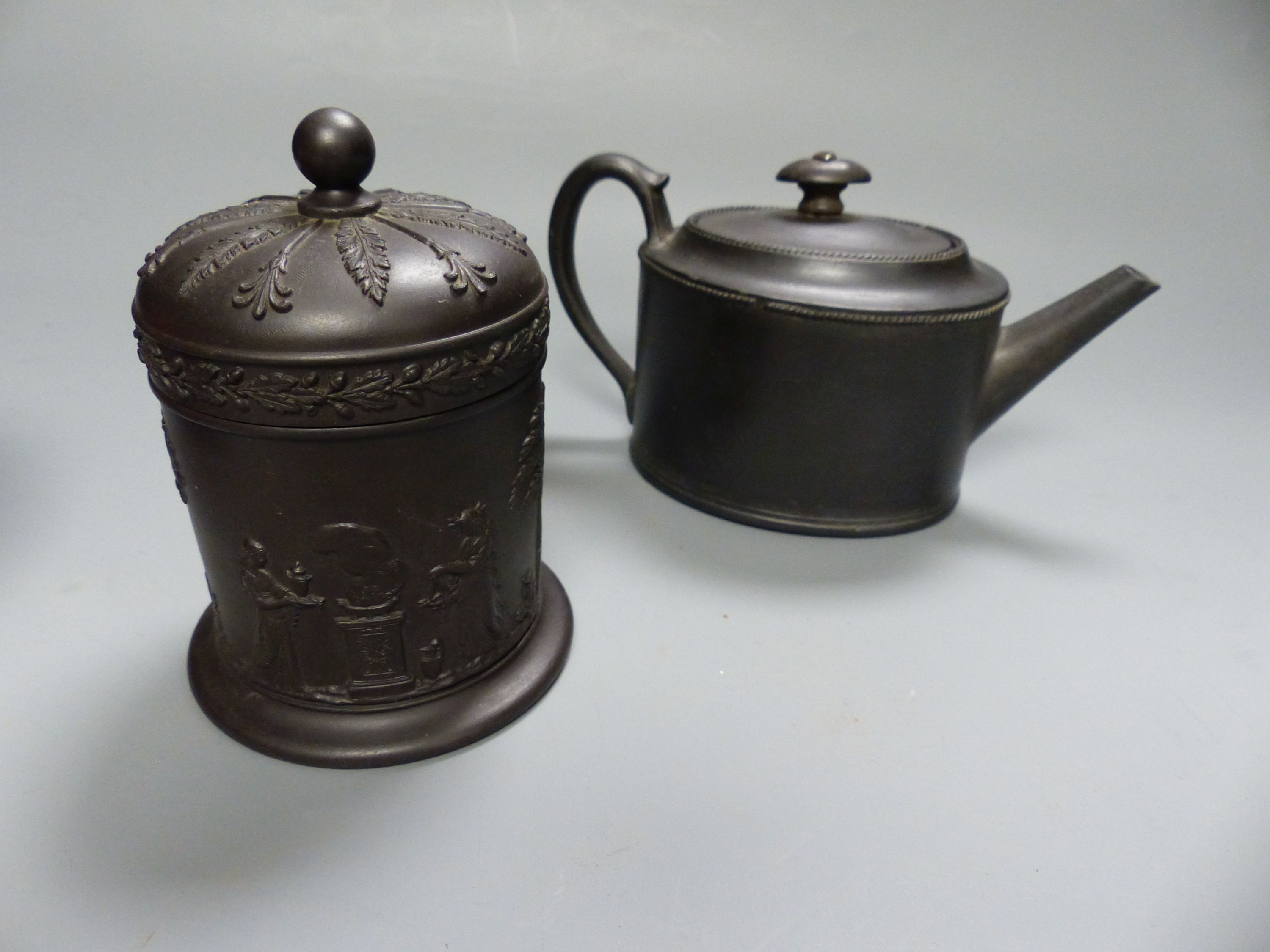 A Chinese Sang de Boeuf censer, a similar celadon glazed bowl, together with a Wedgwood black basalt teapot, c.1800 and a similar 20th